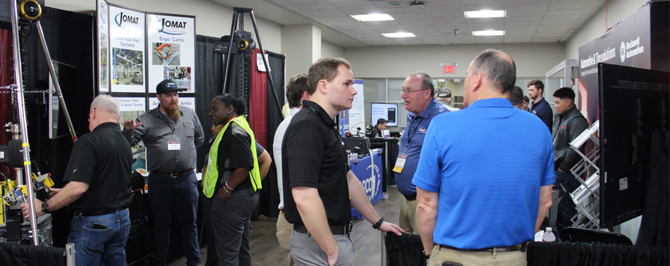 People learning about the various technologies exhibitors brought