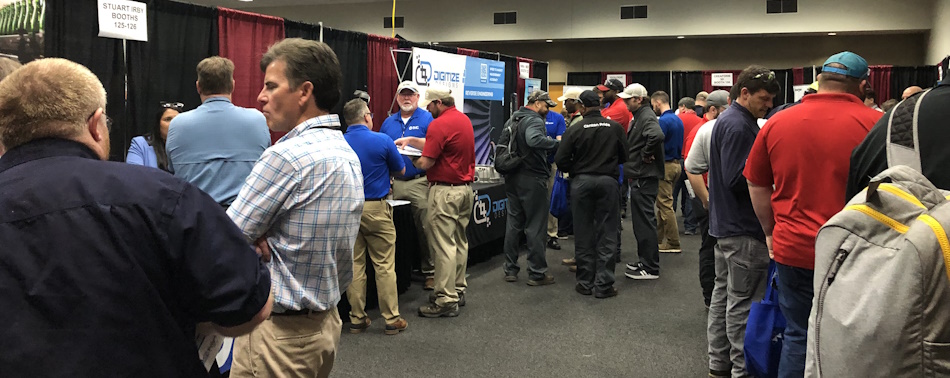 People learning about the various technologies exhibitors brought