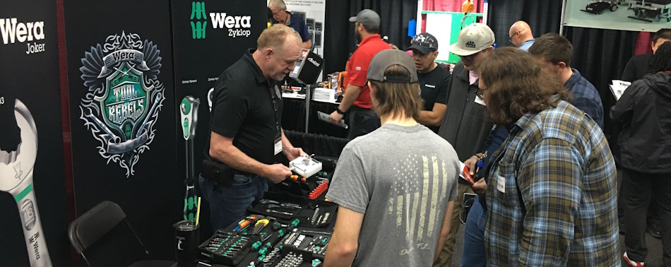 People learning about the various technologies exhibitors brought